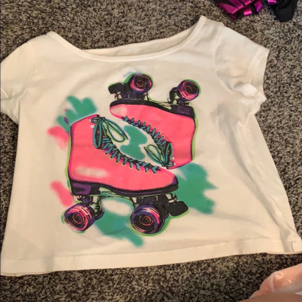 White shirt with pink and green skates